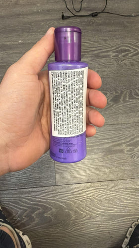 CADIVEU bottle beside a ruler showing 110ml travel-friendly scale