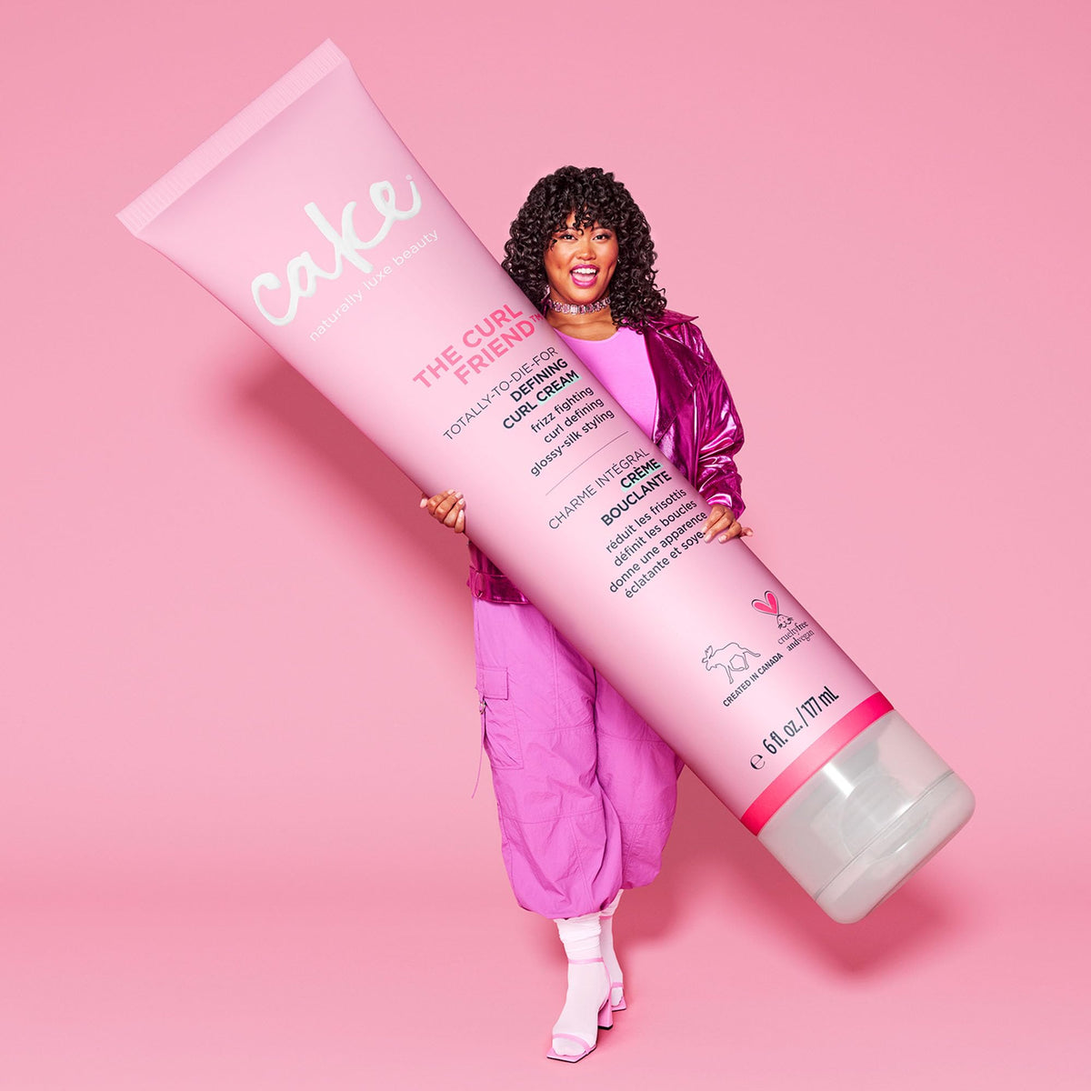 Cake Beauty lifestyle shot of model with voluminous beach curls demonstrating moisture, definition and bounce