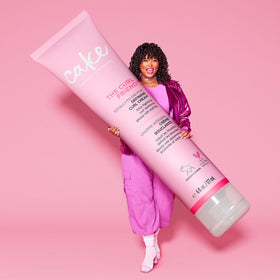 Cake Beauty lifestyle shot of model with voluminous beach curls demonstrating moisture, definition and bounce