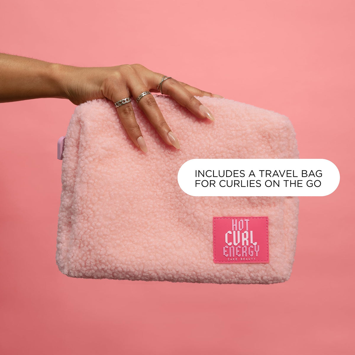 Cake Beauty pink pouch and duo styled for travel-ready convenience