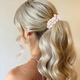 CAKURE size comparison next to a coin showing scrunchie scale and fit