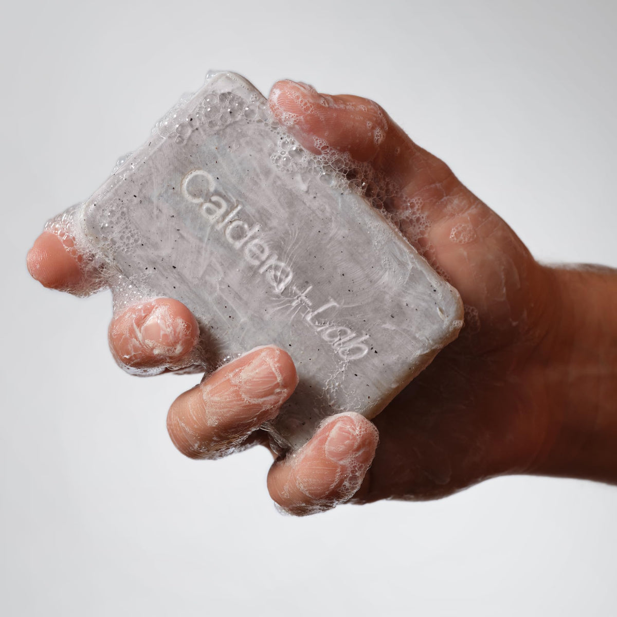 Caldera + Lab exfoliant texture close-up revealing gentle scrub particles