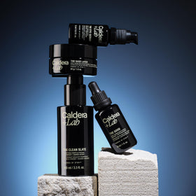 Caldera + Lab regimen displayed on bathroom counter in a modern lifestyle setting