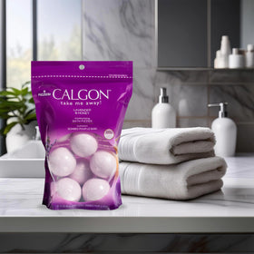 Hand holding a Calgon fizzy to show scale and single-use portion