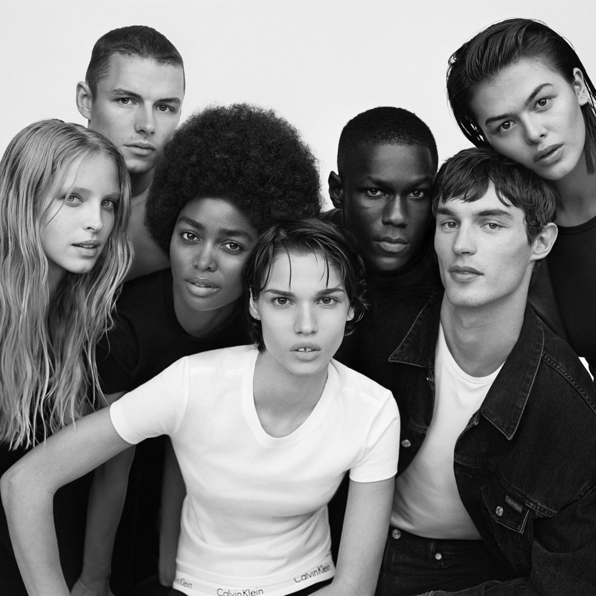 Calvin Klein CK One lifestyle scene with couple sharing lotion for versatile unisex use