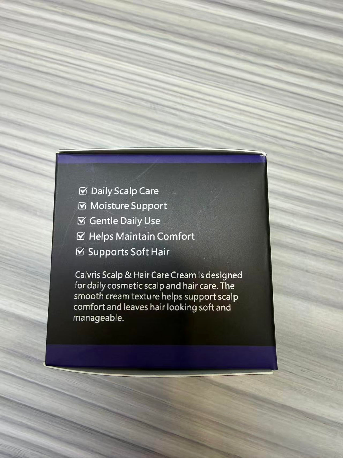 Calvris applied to scalp by fingertips for targeted hydration benefit