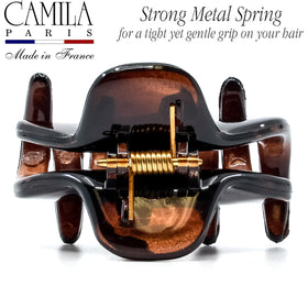 Camila securing a small bun to show styling versatility and no-slip hold benefit