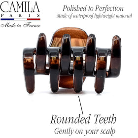 Camila held in hand to show 1.75-inch scale and travel-ready convenience benefit