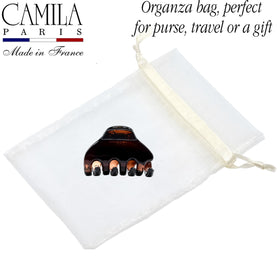 Camila side profile open to display jaw mechanics and comfortable grip benefit