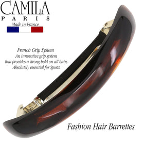 Camila holding a low bun to show strong clamp and comfortable all-day wear