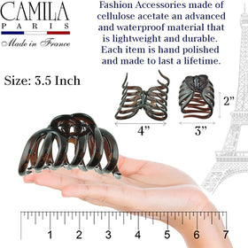 Camila Paris holding a full bun on thick hair for no-slip styling
