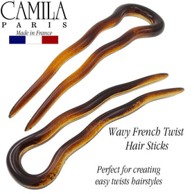 Camila Paris hair fork in hand showing 3-inch scale and travel-friendly size