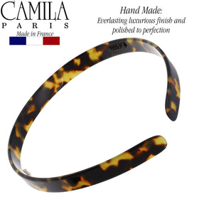 Camila Paris headband in hand showing compact size and lightweight benefit