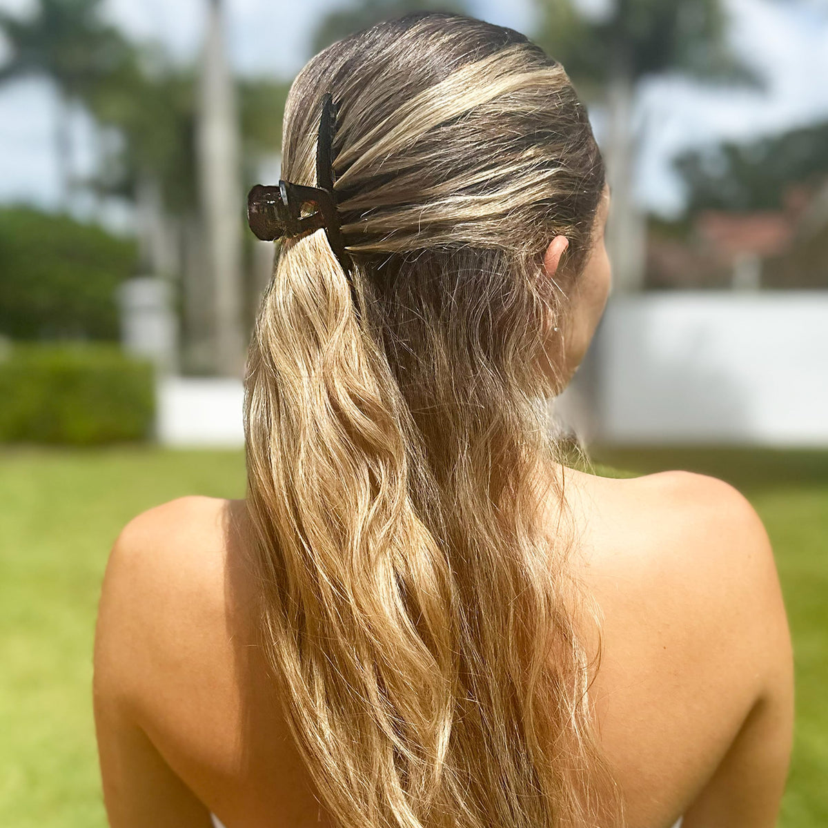 Camila Paris bun updo demo holding a full bun comfortably
