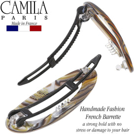 Camila Paris size comparison with coin demonstrating compact two-inch scale