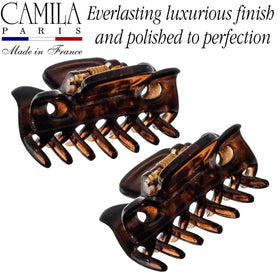 Camila Paris clip in hand for scale demonstrating compact travel-friendly size