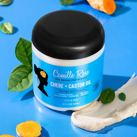 Camille Rose butter on hands demonstrating smooth glide and better manageability