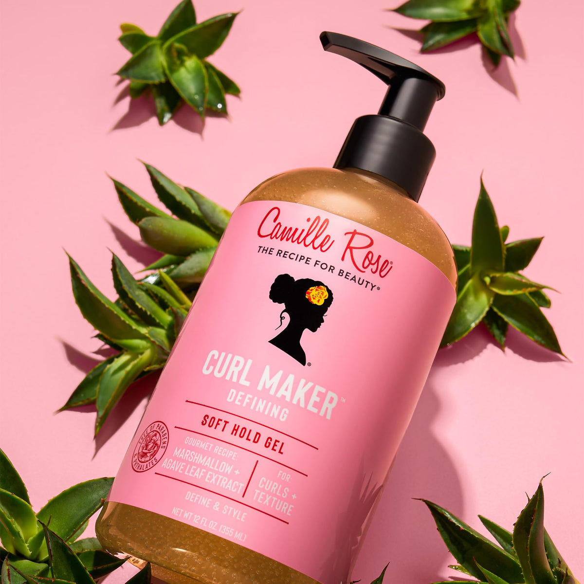 Camille Rose applying leave-in and gel to wet curls for definition