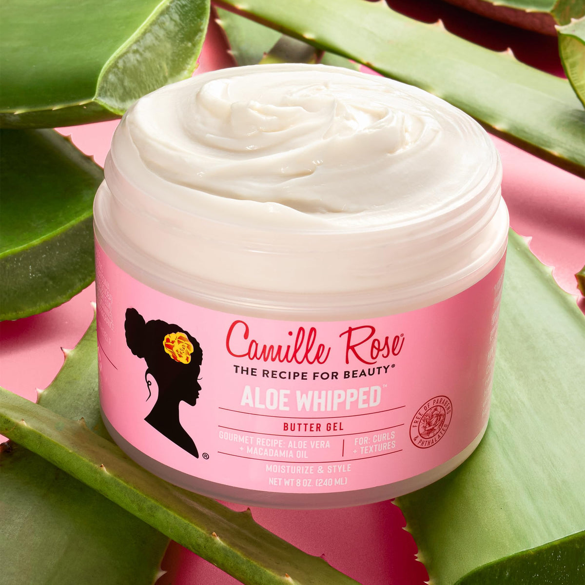 Camille Rose being smoothed into wet hair to lock moisture and reduce frizz