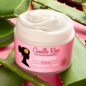 Camille Rose being smoothed into wet hair to lock moisture and reduce frizz