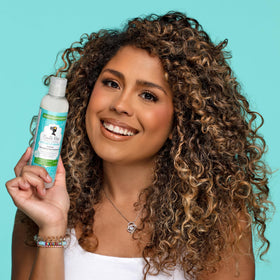 Camille Rose used on dry hair to refresh curls and tame frizz