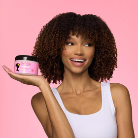 Camille Rose defined curls after application demonstrating soft, bouncy definition