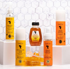 Camille Rose being applied to curly hair for definition and frizz control during styling