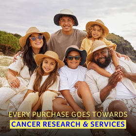 Cancer Council bottle on beach towel showing water-resistant active use