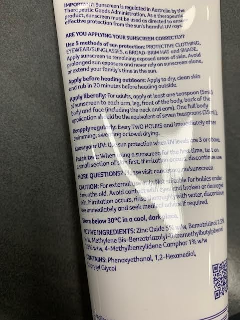 Cancer Council tube size comparison in hand showing compact 110ml for travel convenience