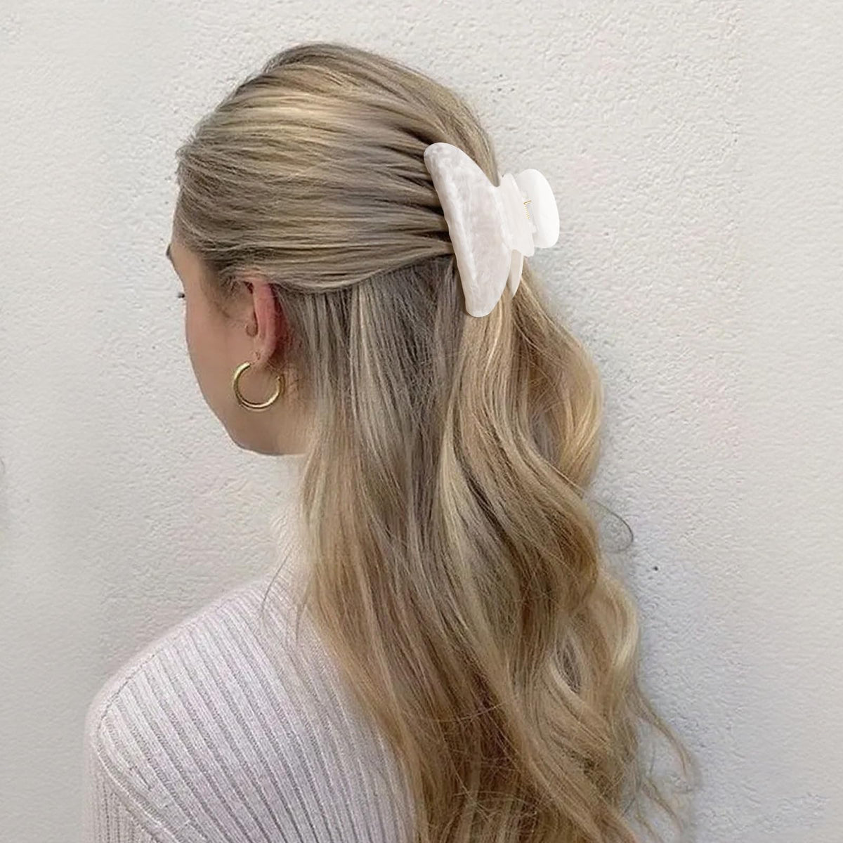Canitor holding hair while washing face demonstrating practical daily use