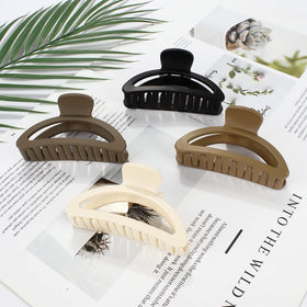 Canitor clip holding a full bun confidently, strong hold for thick hair