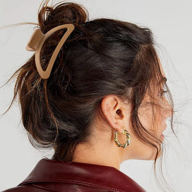 Canitor clip in hair making a half-up bun, quick stylish everyday convenience