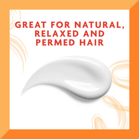 Cantu being applied to damp hair for smoother styling and reduced frizz