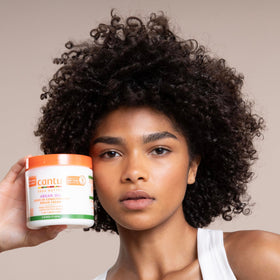 Cantu cream on palm demonstrating easy spreadability and nourishment