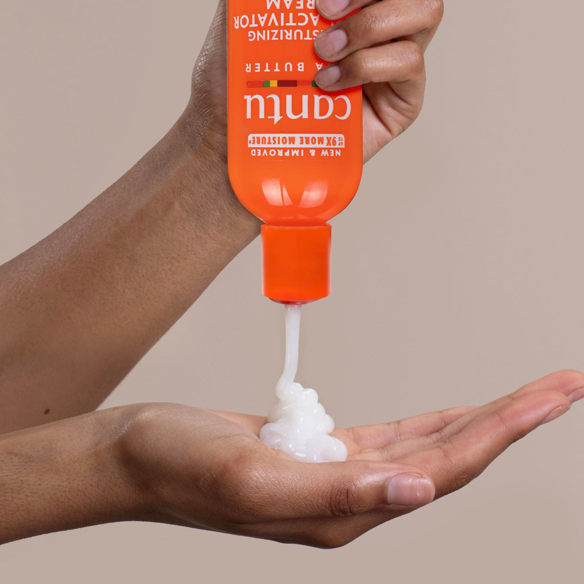 Cantu curl activator being diffused into damp curls to boost volume