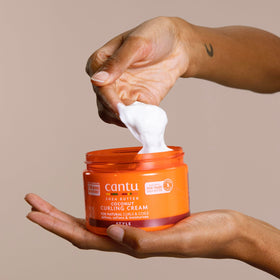 Cantu jar label close-up listing coconut and shea ingredients