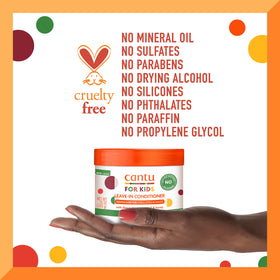 Child smiling in bathroom using Cantu for a simple kid-friendly hair routine
