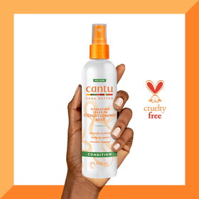 Cantu mist being applied to wet hair for detangling and softening benefits