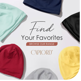 CAPLORD flat lay with bonnet beside ruler to show sizing and volume capacity