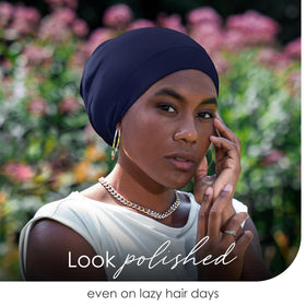 CAPLORD model wearing bonnet over locs to show roomy fit and protective coverage
