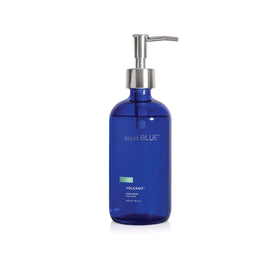 Capri Blue front bottle showing cobalt glass and Volcano scent benefits