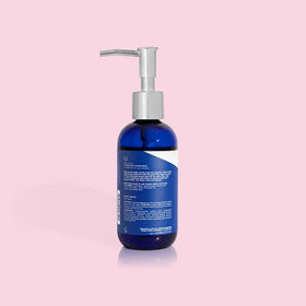Capri Blue refill demonstration showing refillable bottle convenience