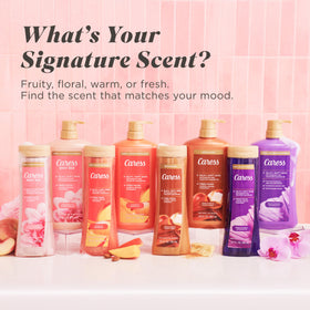Four-pack arrangement of Caress bottles showcasing value and convenience