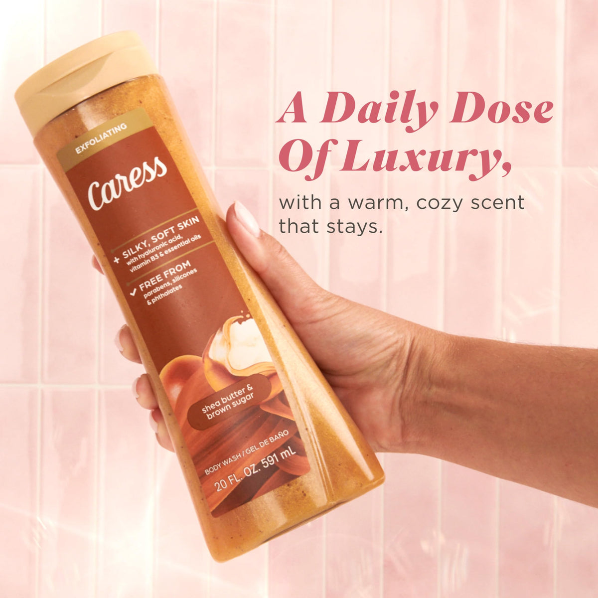 Caress bottle next to hand for scale illustrating the 20 fl oz practical volume