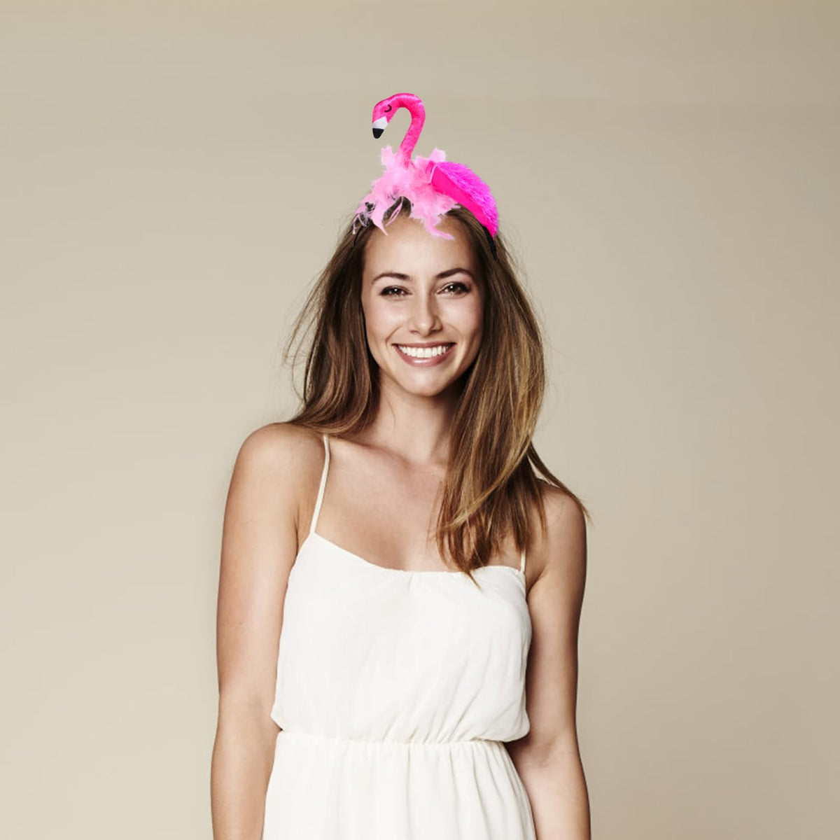 CARMELIT flamingo headband stored flat to show care and shape-preserving method