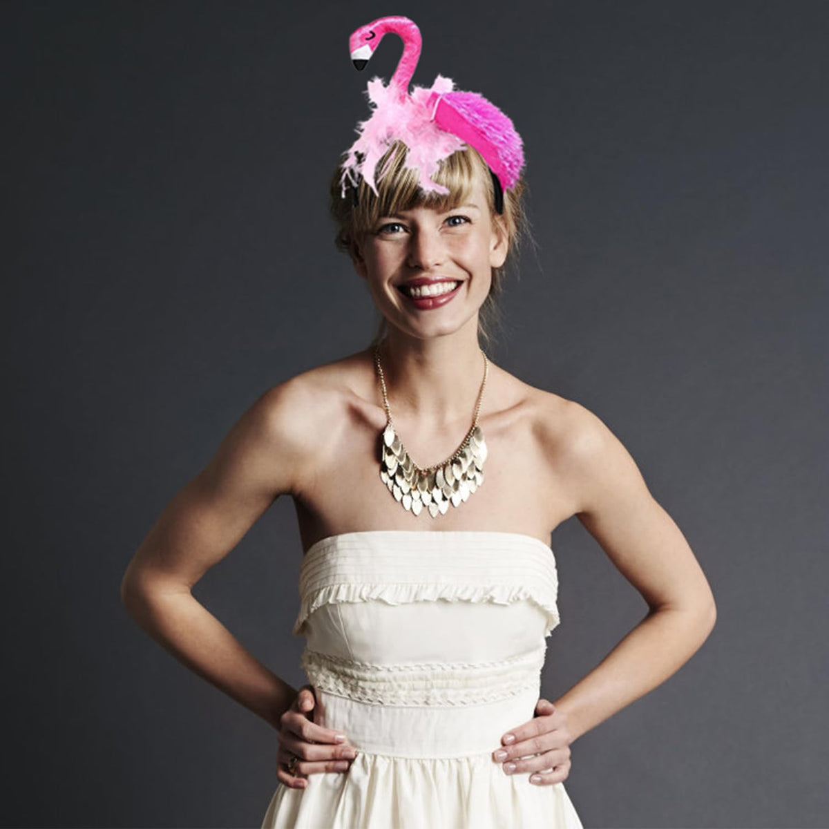 CARMELIT flamingo headband paired with luau props illustrating themed styling ideas