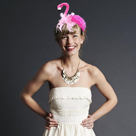 CARMELIT flamingo headband paired with luau props illustrating themed styling ideas