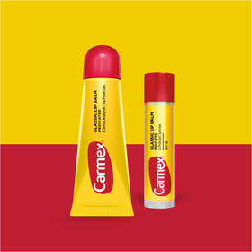 Carmex tube close-up highlighting smooth texture and moisturizing cocoa butter