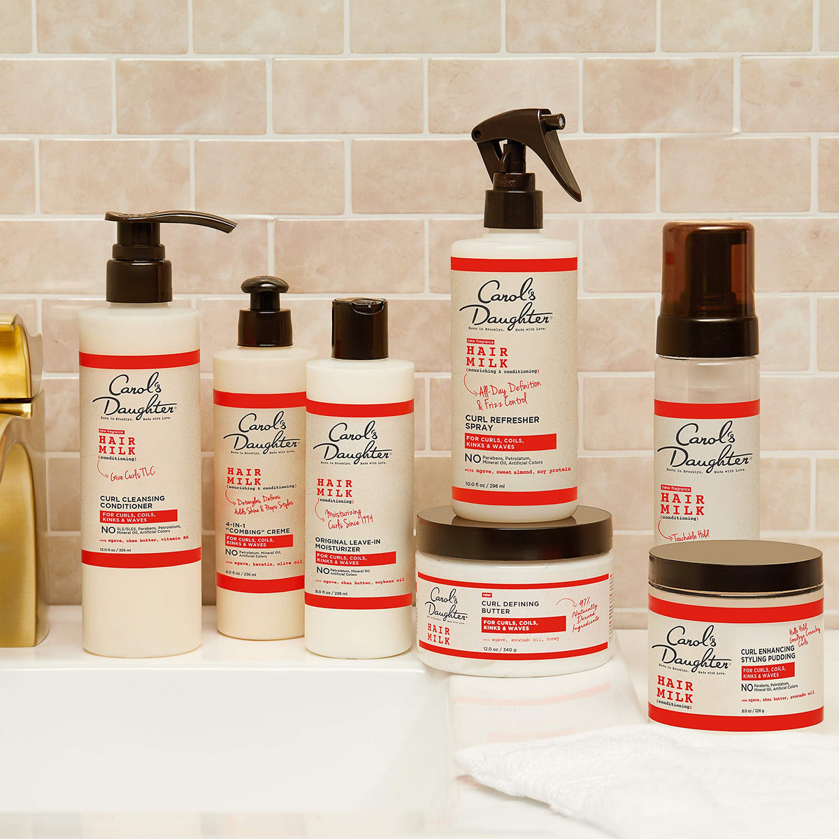 Carol's Daughter bottle on bathroom shelf in styled setting suggesting daily use