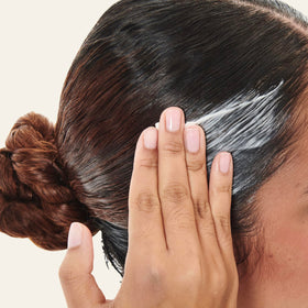 Carol's Daughter applied at hairline smoothing edges for protection